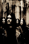 Lord Belial -bändin mustavalkoinen promokuva. Kuvassa neljä miestä seisoo ruosteista rautaseinää vasten. Miehillä on pitkät, tummat, hiukset ja viiksi-parrat.